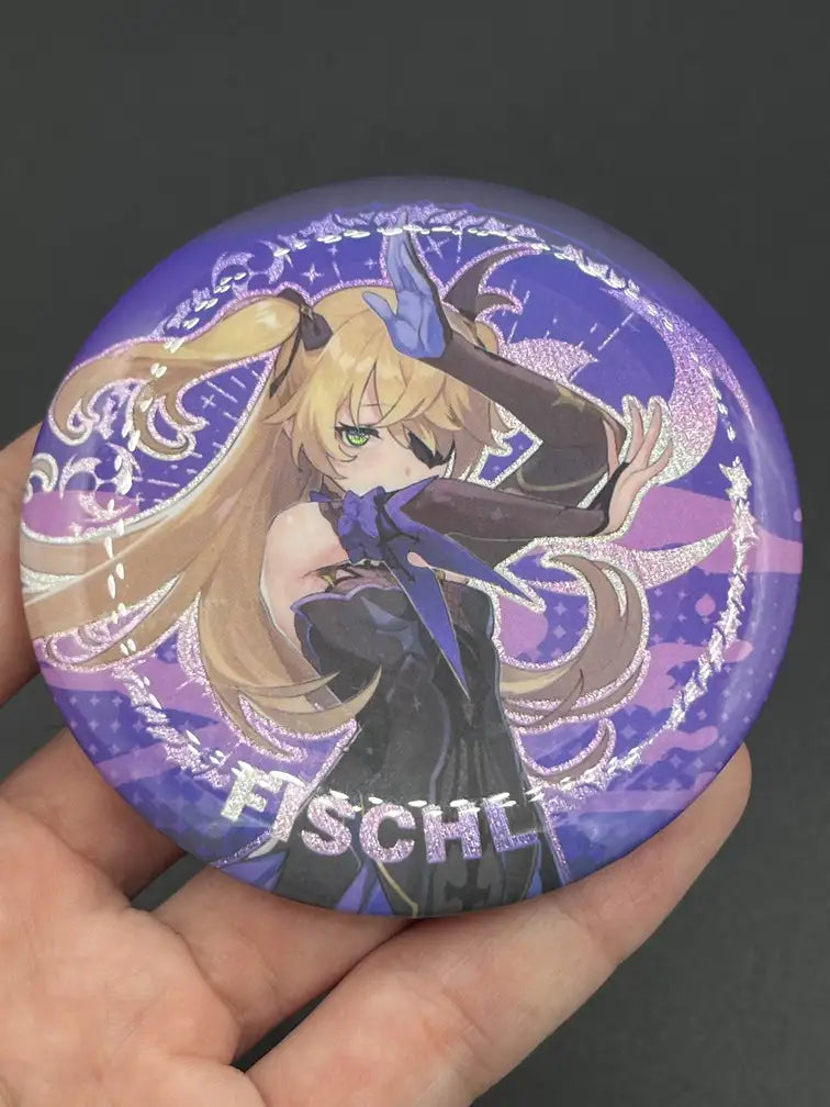 Fischl Genshin Impact Anime Badge – Held in Hand, Showing Size and Detail | The Void Vault