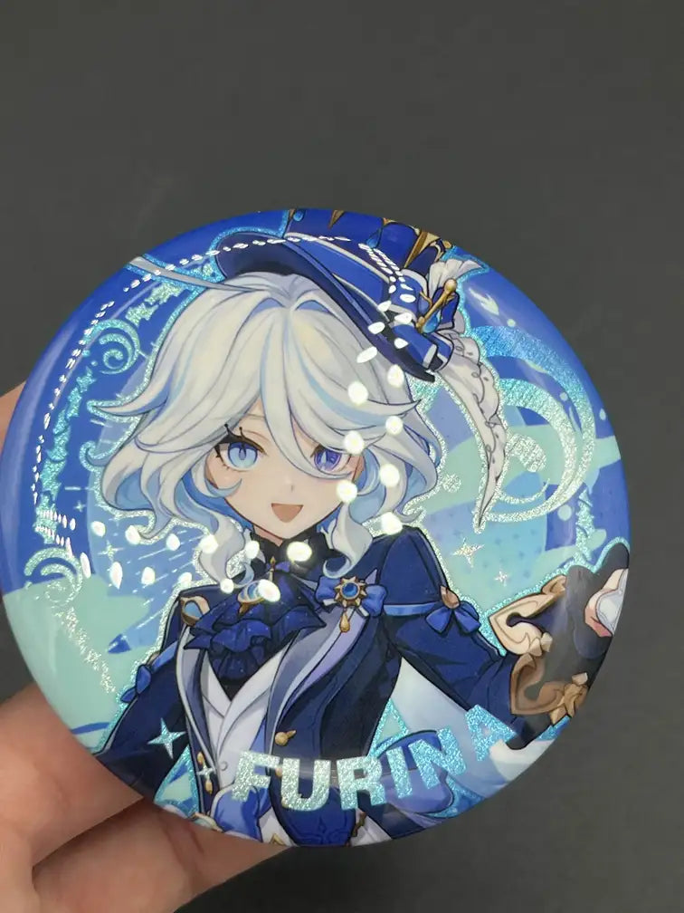 Furina Genshin Impact Anime Badge – Held in Hand, Showing Size and Detail | The Void Vault