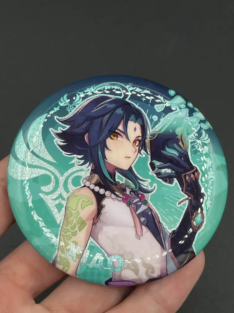 Xiao Genshin Impact Anime Badge – Held in Hand, Showing Size and Detail | The Void Vault